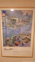 Full framed print showing Monet's water lily painting and signature text