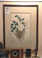 Full view of framed woodblock print with two quails and lespedeza flowers, showing the frame and surrounding items.
