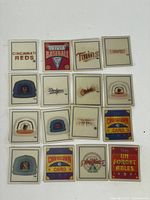 Fronts of 16 Sportflics Trivia Baseball cards showing team logos and designs