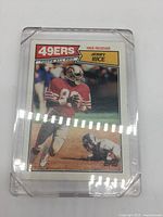 Front view of 1987 Topps Jerry Rice #115 card in plastic case