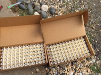 Two open boxes showing grid of capped vials