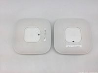 Front view of two Cisco access points