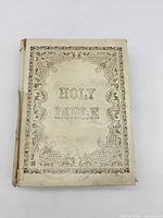 Front cover showing ornate design and condition wear along spine