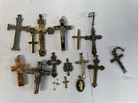Group shot showing all 16 crucifix and cross pendants