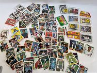Wide view of entire lot showing approximately 80 assorted MLB baseball trading cards from various brands.