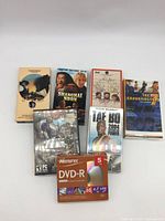 All seven items laid out, showing titles and packaging