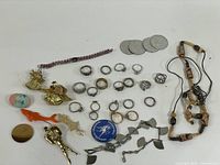 Overview of all jewelry pieces spread on surface