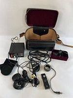 All items laid out including converter, cables, accessories, and open case