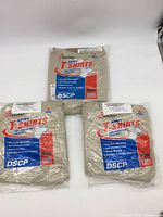 Three sealed Skilcraft DSCP Army T-shirts in sand color