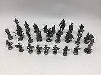 All 28 Roman chess pieces arranged in rows