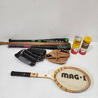 Photo showing the full lot: 3 bats, 2 gloves, 2 Wilson 3-packs of tennis balls, and 1 wooden Wilson Jack Kramer tennis racket.