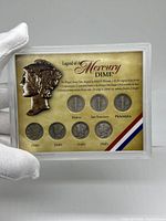 Front view of coin set encased in a protective holder with legend about Mercury dimes and images of coins from various decades and mints.