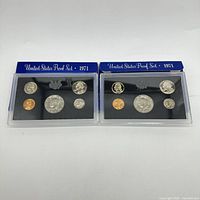 Two sealed 1971 United States Proof Sets each containing five coins.