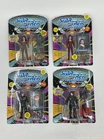 Four sealed Star Trek: The Next Generation action figures in original blister packaging, including figure, accessories, and character card.