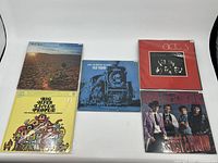 Five vinyl records arranged for clear view of front covers including Jason & The Scorchers and others.