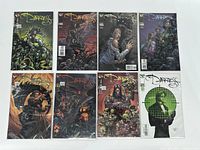 Eight comic books from The Darkness series arranged, front covers visible, in protective bags and boards on white background.