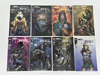 Full view of 8 Darkness comic books in protective bags and boards laid out in two rows of four.