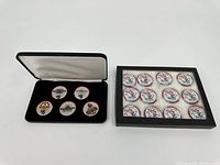 Two different sets of $5 poker chips in respective display cases. One velvet lined, one black framed case.