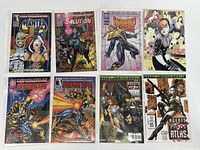 Lot of 8 comic books displayed side by side in protective bags and boards on a wooden surface.