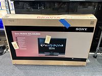 Sony Bravia KDL-32L4000 television in original box showing front packaging and branding details.