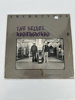 Front cover of The Velvet Underground "White Light White Heat" vinyl record showing band name, album title, and black and white photo of two men at subway station.