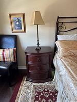 Full view of bedside table in situ next to bed and chair