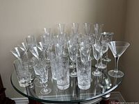 Wide view of all crystal stemware glasses on table showing quantity and various styles