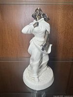 Full view of the Minton Sea Breezes figurine showing the bronze head and arms with porcelain dress and base.