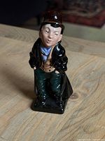 Front view of the Royal Doulton Artful Dodger figurine showing detailed facial expression, clothing, and glossy finish.