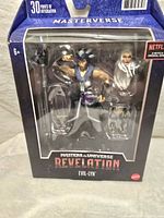 Front view of the unopened Masters of the Universe Masterverse Evil-Lyn action figure in packaging showcasing figure and accessories.