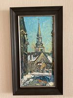 Full view of framed impasto oil painting cityscape