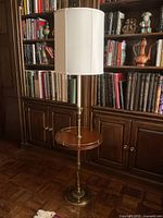 Front view of entire lamp in front of bookcase