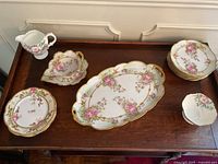 Overview of all pieces displayed on wood surface