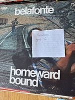 Close-up of Harry Belafonte 'Homeward Bound' album cover with handwritten note 'Belafonte group 15'