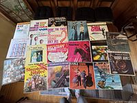 Photo showing the full set of 20 vinyl records laid out on a flat surface, focusing on album covers and condition.