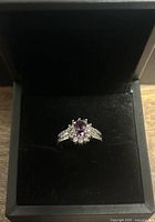 Front view of ring in black jewelry box showing overall design