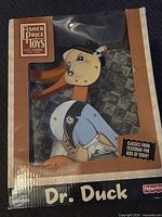 Front view of the Fisher Price Dr. Duck toy in original packaging showing the toy and branding.