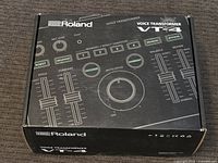 Top view of the Roland VT-4 Voice Transformer box showing the control panel diagram and branding.