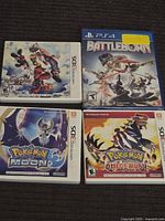 Photo showing 4 Nintendo 3DS game cases: Kingdom Hearts 3D, Pokemon Moon (case only), Pokemon Omega Ruby, Pokemon Sun; and a sealed PS4 Battleborn game.