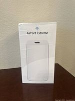 Front of original box showing image of Apple AirPort Extreme router and branding