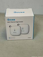 Front view of the Govee Wi-Fi Thermo-Hygrometer 2 pack box showing the device image and brand.