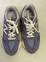 Top view of the New Balance 9060 sneakers showing laces, shape, and condition of the uppers.
