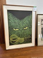 Full view of framed pastel cat artwork showing overall condition and framing