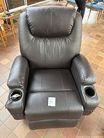 Front upright view of dark brown synthetic leather recliner with cup holders in both armrests