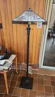 Full front view of Tiffany style floor lamp showing overall height, shade and base
