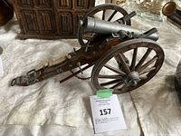 Side view of the Dahlgren 1861 cannon model showing metal barrel, wooden carriage, and wheels.