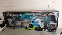 Full box of AeroQuest 2.4 GHz 3.5 Channel RC Helicopter showing product details and remote controller.