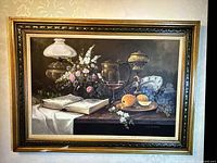 Full frontal view of painting and frame on patterned wallpaper