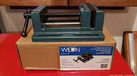 Photo of Wilton drill press vice displayed on its original cardboard box with detailed label showing model number and specifications.