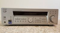 Front view of Sony STR-K740P home theatre receiver showing control panel, display, function buttons, and volume knob